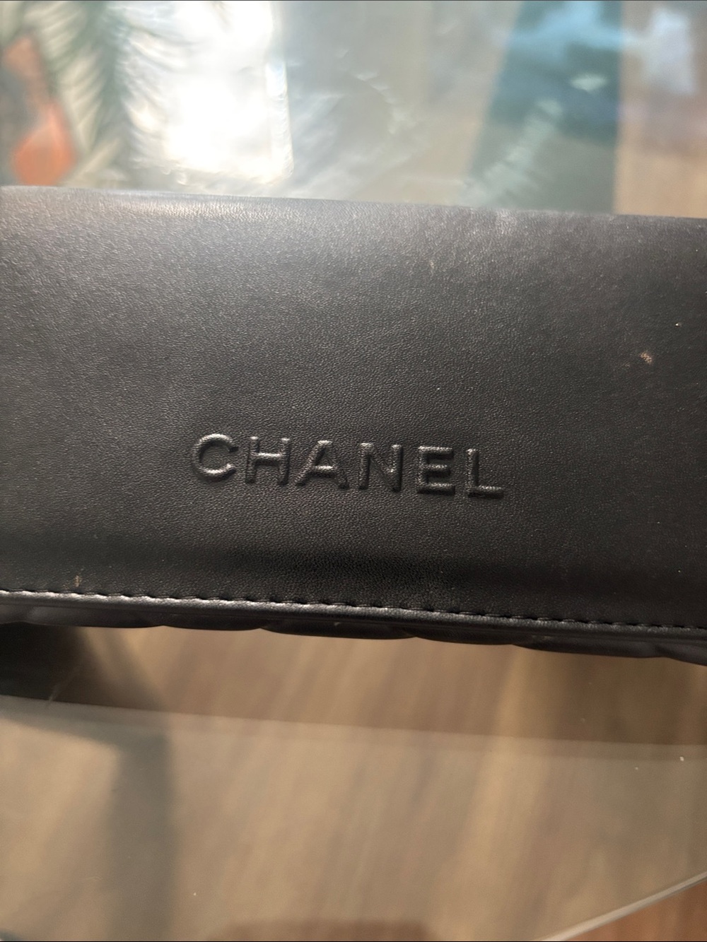 CHANEL Black Embossed Logo Leather Clutch